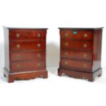 A pair of 20th century Georgian revival mahogany bachelors’ bedside chest of drawers being raised on