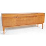 A vintage retro mid 20th Century teak wood sideboard having a central bank of three drawers