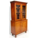 A 19th Century Victorian mahogany library bookcase cabinet having twin glazed panel doors housing