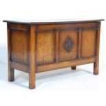 An early 20th Century 1930's oak blanket box chest having a hinged lid to the top over paneled sides