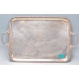 An antique silver plated tray of rectangular form having beaded borders and well cast leaf design