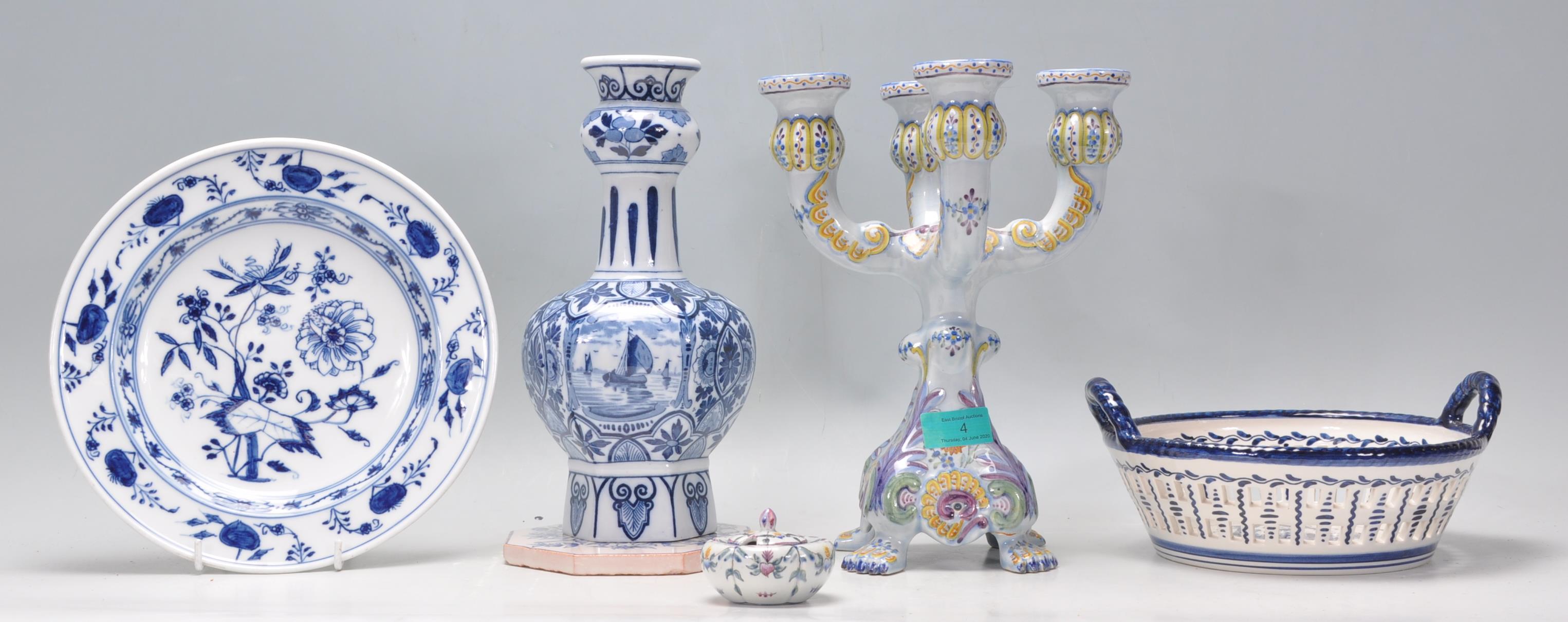 A collection of 20th Century Delft and Faience ware items to include a blue and white guglet vase