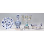 A collection of 20th Century Delft and Faience ware items to include a blue and white guglet vase