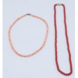 A 20th Century vintage coral necklace having round 'angle skin' beads together with a red beaded