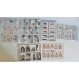A collection of vintage military and transport related cigarette cards to include Player's;