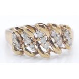 A hallmarked 9ct gold and diamond cluster ring. The ring having woven stylised cluster setting