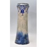 A late 19th Century Victorian Art Nouveau Royal Doulton vase having a blue glazed finish.