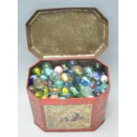 A collection of mostly vintage 1950's glass marbles to include swirl, helix, onion skin and other