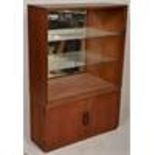 A mid century / circa 1960's Turnidge teak wood library bookcase cabinet having a double door