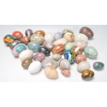 A collection of vintage 20th century oriental Easter eggs to include several hardstone examples,