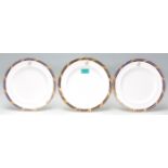 A group of three antique early 20th Century porcelain cabinet plates each being a hand applied