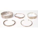 A collection of silver bracelets  and bangles to include Byzantine style, wishbone, 925 white