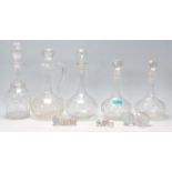 A group of five 20th Century cut glass decanters most of bulbous form together with a collection