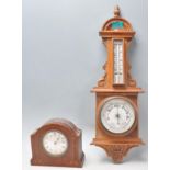 A vintage 20th Century wooden cased banjo wall barometer having carved detail, with thermometer to