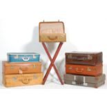 A mixed group of eight vintage / retro travel cases / suitcases with some leather and rexine