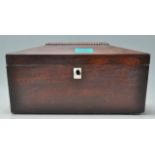 A 19th Century mahogany tea caddy of sarcophagus form having a mother of pearl inlaid panel to the