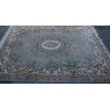 A good large vintage 20th Century Chinese floor rug having cream ground with with floral patterns