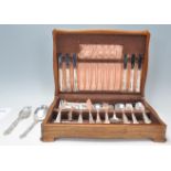 An oak cased canteen of cutlery for six people having a full set of silver plate cutlery within a