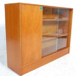 A vintage retro teak wood, circa mid century 1970's library bookcase cabinet having glazed sliding