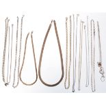 A selection of silver necklace chains to include a flat link snake chain, a gilt silver flat link