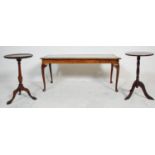 A pair of 19th century style mahogany pedestal wine tables having central columns and tripod legs