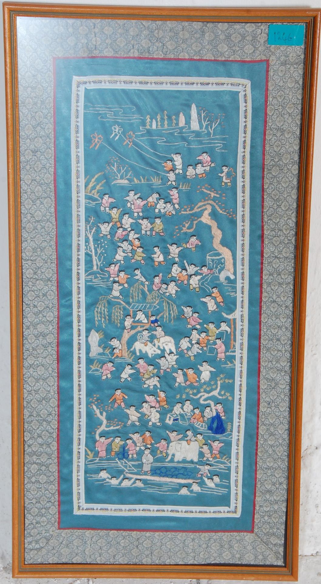 A mid 20th Century Chinese rectangular silk panel having embroidered one-hundred children playing in