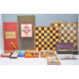 A collection of vintage games to include ebony and bone dominoes, draughts, a 1930's Sorry board