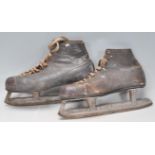 A pair of leather vintage 20th Century ice skates. Size 10. Makers mark for W.H. Fagan & Son Canada.