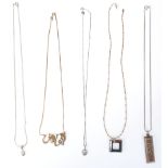 A group of five silver necklaces to include a snake chain necklace with a teardrop pendant, a