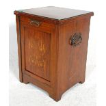 A 19th Century Victorian mahogany coal scuttle purdonium having a marquetry inlaid hinged door