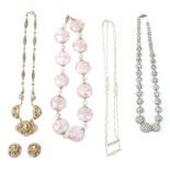 A collection of vintage necklaces to include a yellow tone Christian Dior chain necklace, a Murano