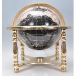 A contemporary 20th Century brass mounted gemstone globe with the country's made from a different