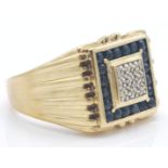A 9ct hallmarked gold sapphire and diamond plaque ring.  The ring having illusion pave set