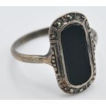A stamped 925 silver pill box of oval form having an enamelled lid decorated with a black and