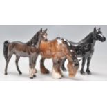 A group of three Beswick ceramic horse figurines t
