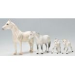 A  collection of 2 Beswick horse porcelain figurines to include 2 dapple grey coloured mares, all