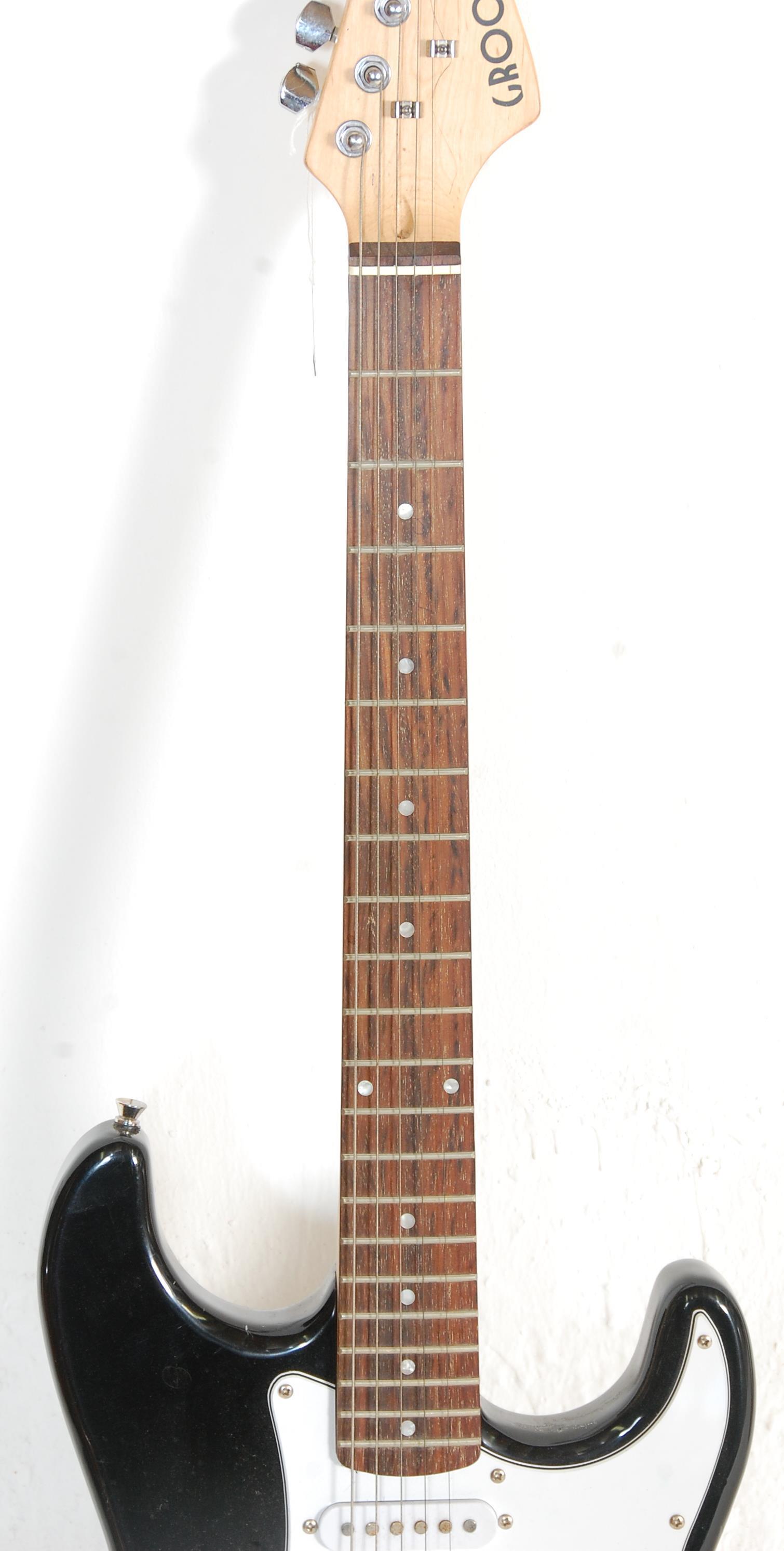 A good Fender style six string electric guitar by Groove having a white scratch guard and black body - Image 4 of 6