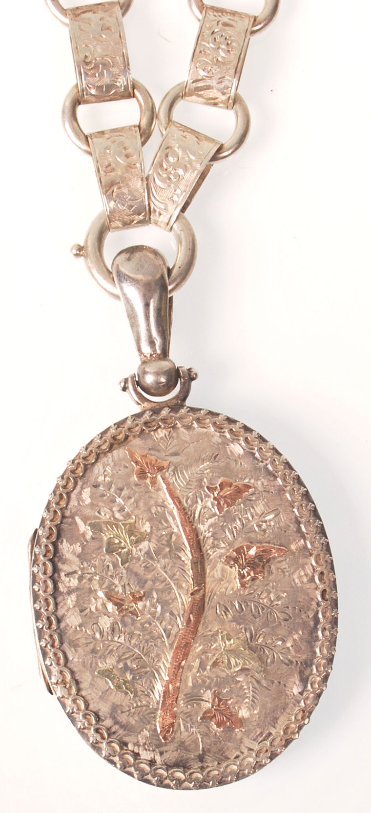 A hallmarked 19th century Victorian silver oval locket pendant being strung upon a book chain. The - Image 4 of 6
