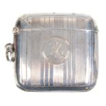 An early 20th Century silver hallmarked vesta case having engraved striped decoration with a central