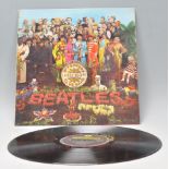 A vinyl long play LP record album by The Beatles – Sgt Pepper's Lonely Hearts Club Band – Original