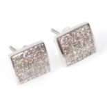 A pair of 14ct white gold ladies earrings having square heads set with a cluster of square cut