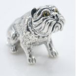 A stamped 925 silver figurine in the form of a British bulldog having yellow glass eyes. Weight 15.