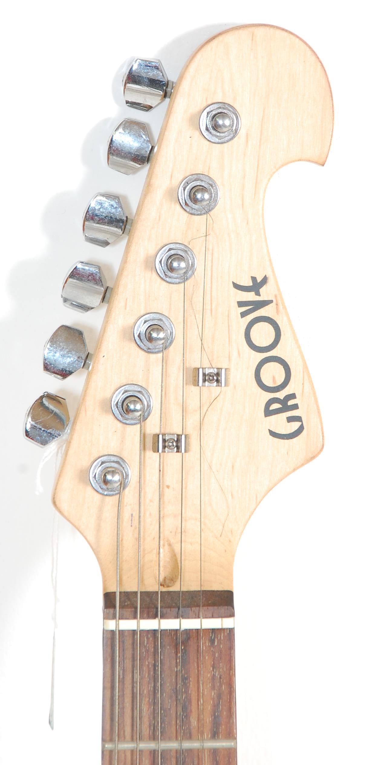 A good Fender style six string electric guitar by Groove having a white scratch guard and black body - Image 3 of 6