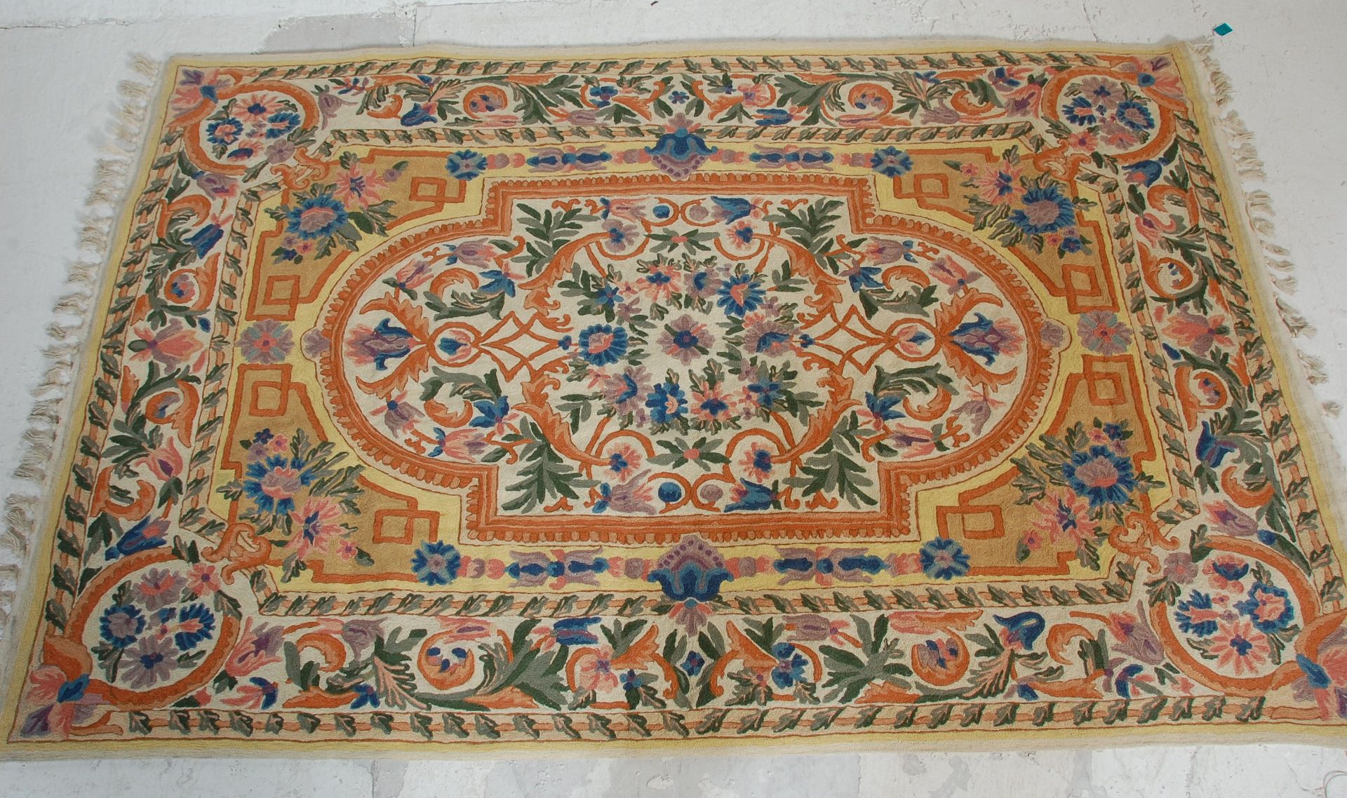 A 20th Century crewel work embroidery wall hanging having a floral bordered design around a - Bild 2 aus 7
