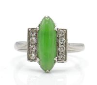 An Art Deco platinum, diamond and nephrite ring. T