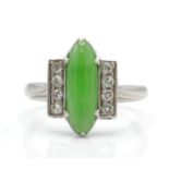 An Art Deco platinum, diamond and nephrite ring. T