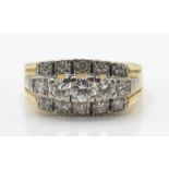 A 14ct / 585 gold and diamond cluster ring. The ri