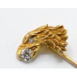 An 18ct gold and diamond figural eagle stick pin.