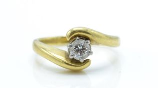 An 18ct Gold & Diamond Solitaire Crossover Ring