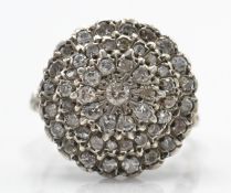 A white gold and diamond cluster ring